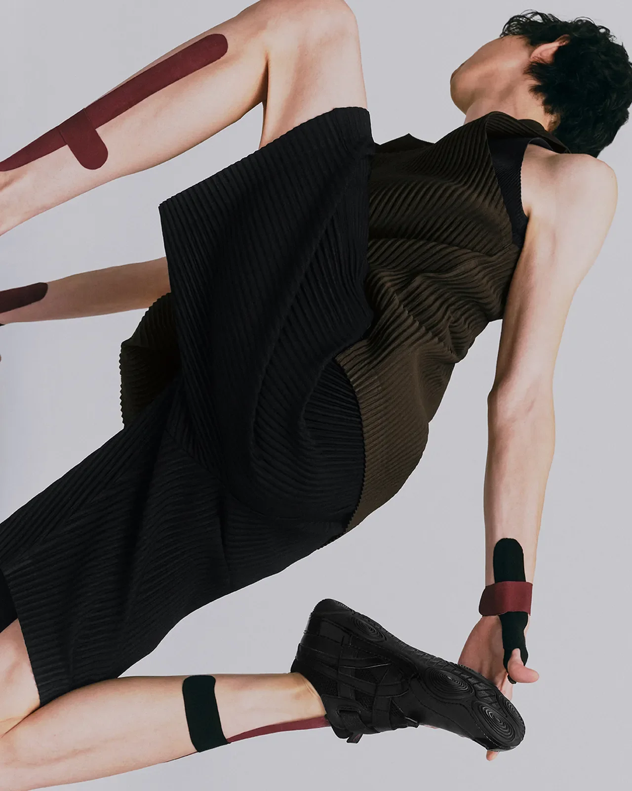 /Photo: ASICS x Miyake — HYPER TAPING™ makes its disruptive debut in fashion.